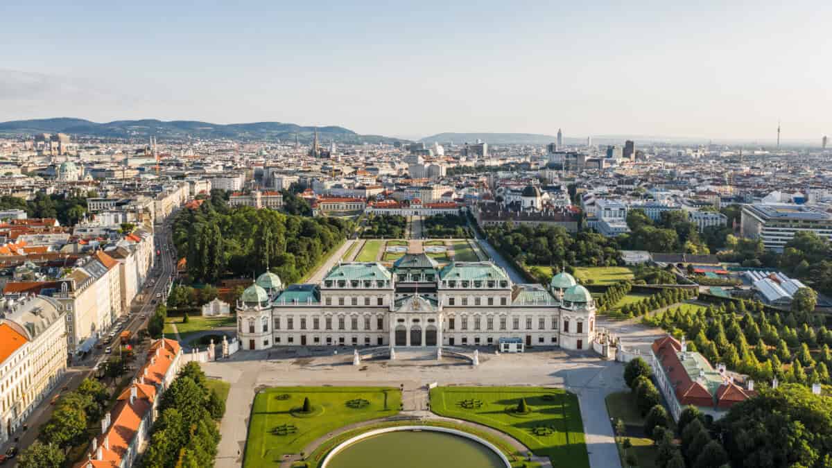 Aerial view of Vienna with historic palace and gardens.